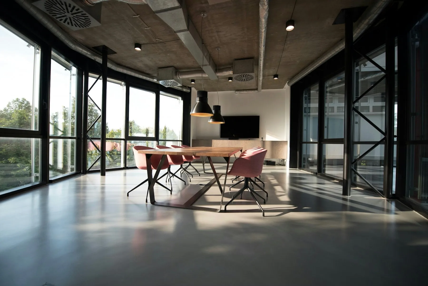 Bright meeting room with a long table and windows
