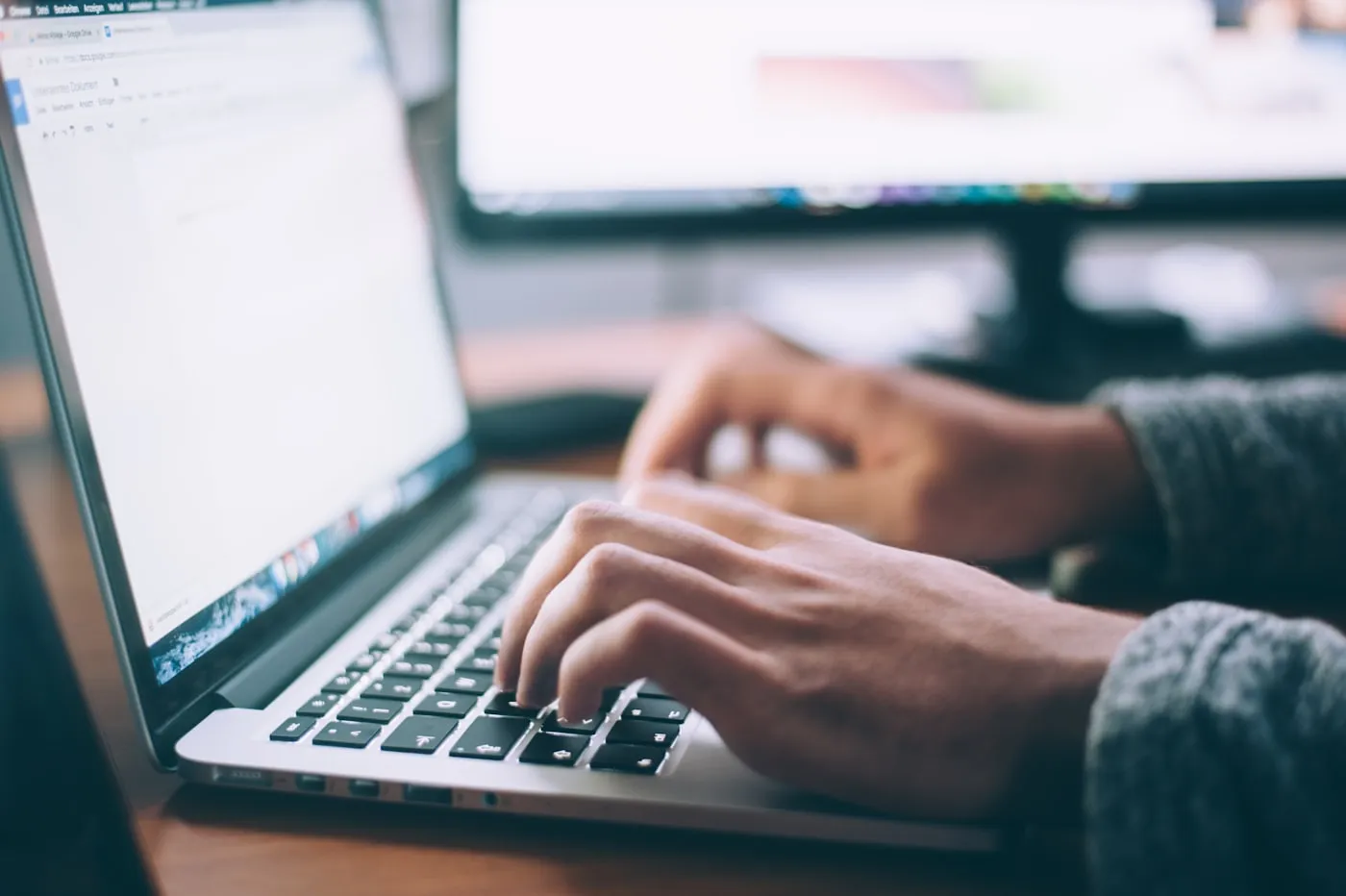 Laptop open on a desk during software development